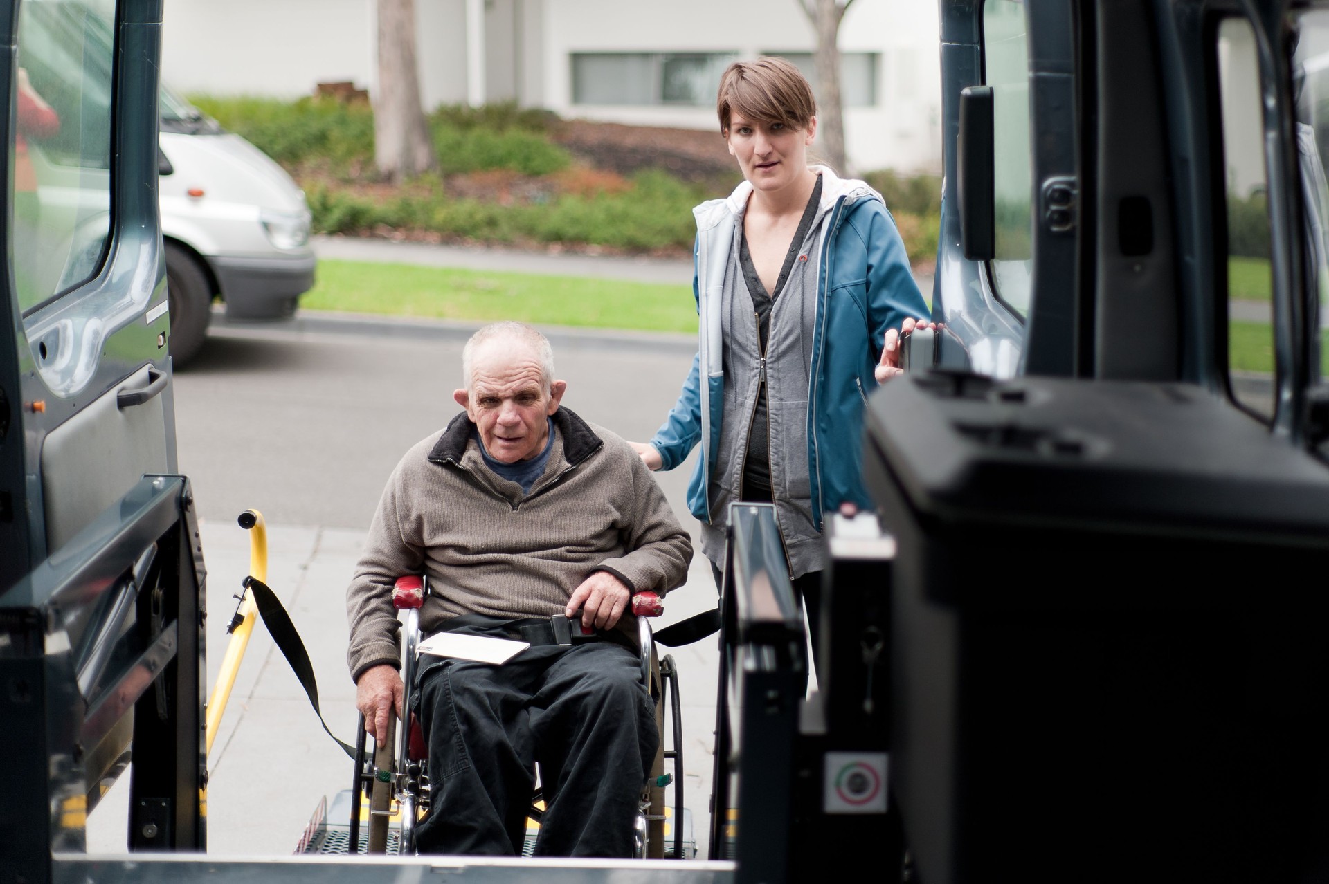 Man in wheelchair entering a modified van